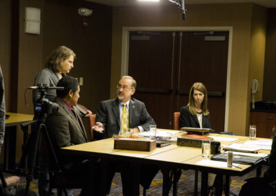 Cathy Dipierro discusses a scene of a deposition in a conference room with the real attorney and the actors in the scene