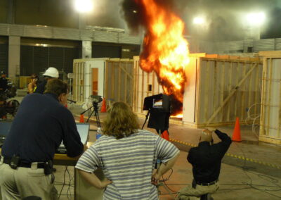 Cathy Dipierro observes a test burn of a single room burn cell on fire at the ATF National Laboratory