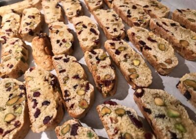 Cranberry pistachio biscotti laid out on a baking shet