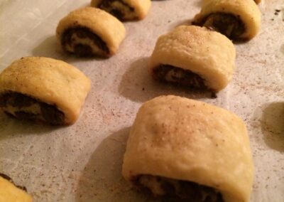 Chocolate rugelach on a baking shet